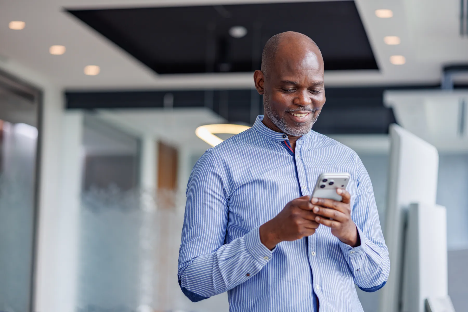 A business owner smiling while taking a call