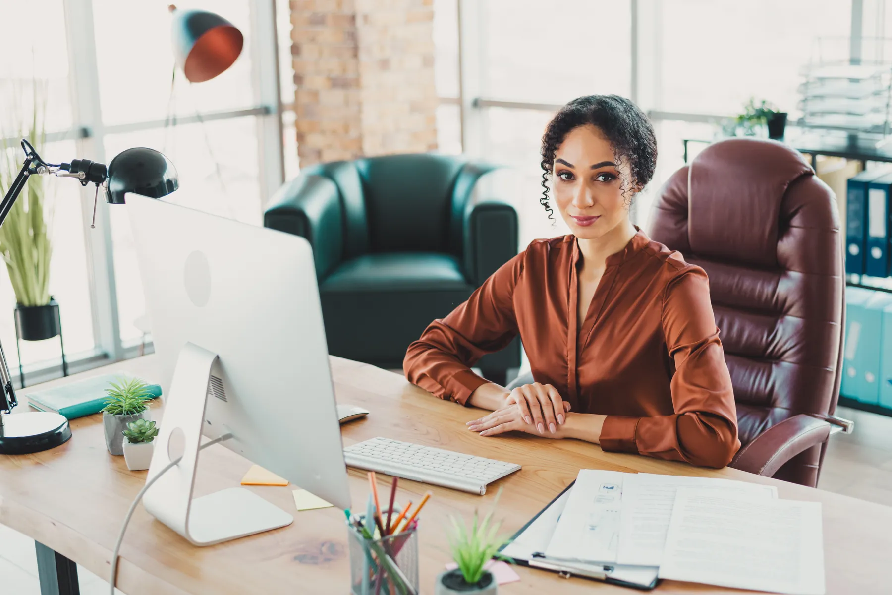 A business owner working through their books at a desk