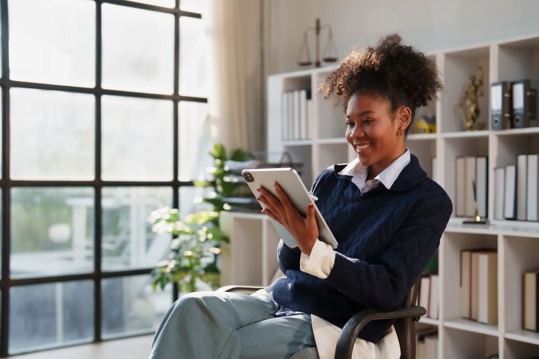 A business owner working through their own books at a laptop