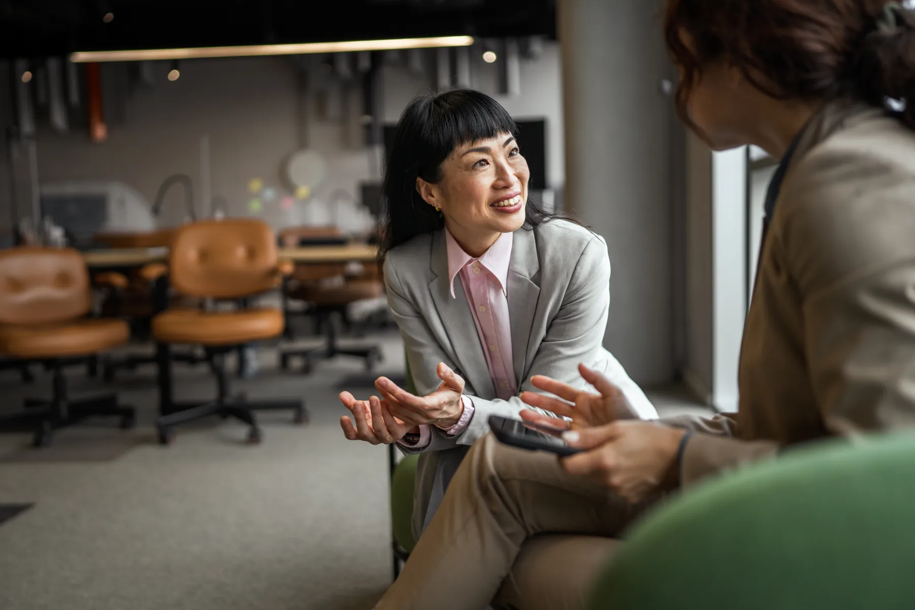 A business owner talking through her figures with her team around a table